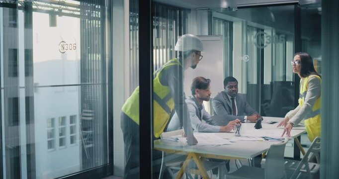 Real Estate Managers Meeting Civil Engineers to Discuss an Opportunistic Construction Project. Diverse Female and Male Specialists Meeting in a Conference Room in a Modern Office Building