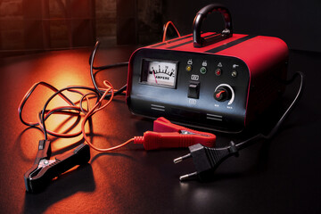 red new car battery charger with ammeter and terminals for 6 volts and 12 volts