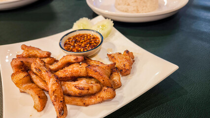 Fried pork and jaew sauce, Thai food crispy fried pork and jaew dipping sauce, spicy and sour taste.