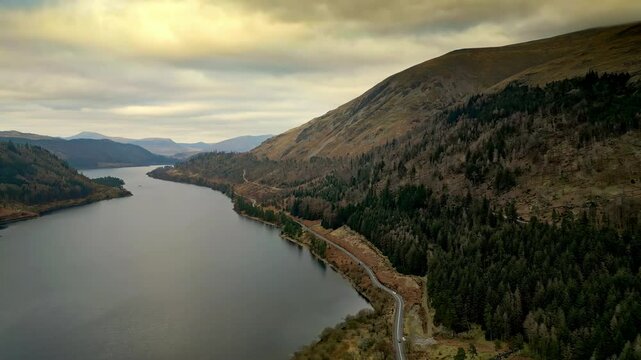 Dramatic beauty of the Cumbrian countryside through mesmerizing drone footage, capturing Thirlmere Lake and the majestic mountains that envelop it.