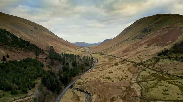 Dramatic beauty of the Cumbrian countryside through mesmerizing drone footage, capturing Thirlmere Lake and the majestic mountains that envelop it.