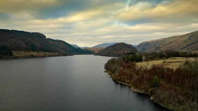Dramatic beauty of the Cumbrian countryside through mesmerizing drone footage, capturing Thirlmere Lake and the majestic mountains that envelop it.