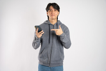 Portrait of asian man wearing hoodie posing on white background