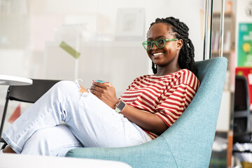 	
In her college office, a determined black female student stands confidently, a beacon of...