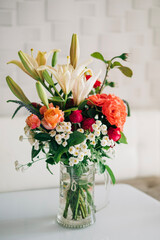 Beautiful pink flowers composition in the vase close-up view. Festive decoration and background