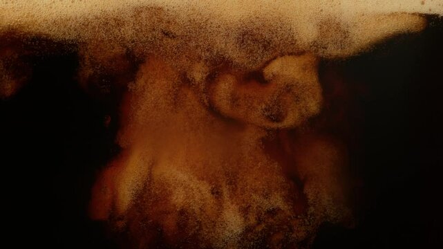 Super Slow Motion Detail Shot of Pouring Fresh Creamy Coffee at 1000fps.