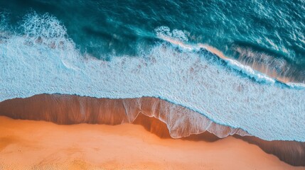 Fototapeta premium View from above of turquoise waves crashing on sand