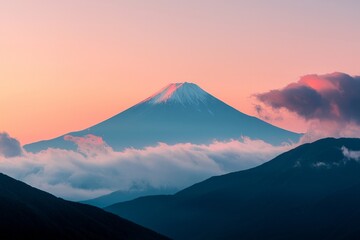 The peak of a distant mountain framed against a sunset sky
