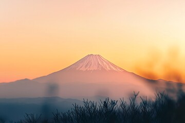 Fototapeta premium The peak of a distant mountain framed against a sunset sky