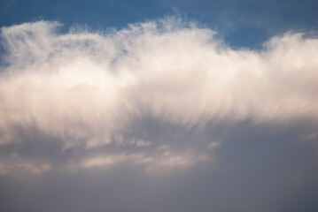 dramatic clouds in blue sky