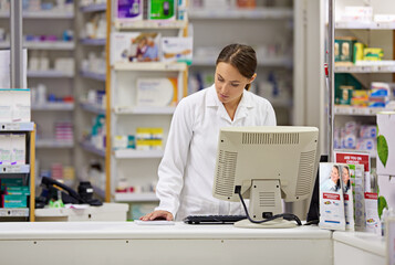 Pharmacy, computer and stock list with woman at counter in drugstore for customer service, advice...