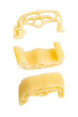 Dry colored macaroni, pasta on empty background.