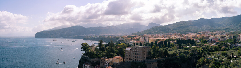 Obraz premium Panorama Scenic View of Sorrento Coastline and harbor against beautiful mountain landscape, Italy