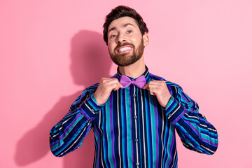 Photo of handsome elegant positive glad man wear stylish clothes isolated on pink color background