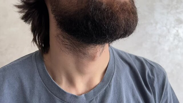 Man swallowing highlights the movement of the adam's apple, showcasing anatomy and physiology in detail