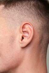 Obraz premium Close Up Of A Mans Ear With Short Hair