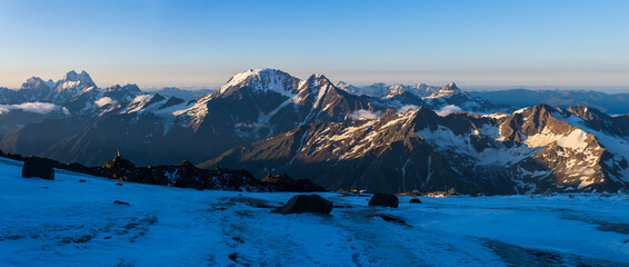 mountain peaks in morning light, panoramic natural landscape
