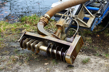 Auger of a dredger that clears and deepens ponds and lakes