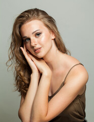 Naklejka premium Cute healthy young woman, beautiful face closeup on white background