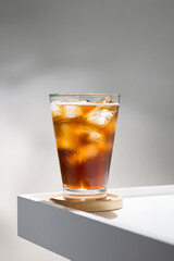 An iced americano in clear glass, simple elegance.