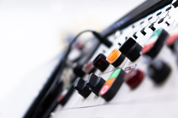 Buttons on the industrial electrical control panel of high pressure pump warehouse, blurred background