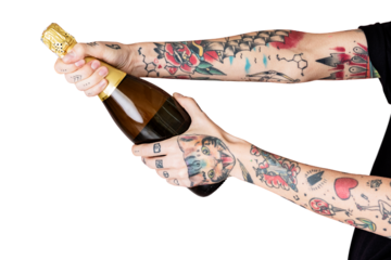 Tattooed hand holding a bottle of champagne