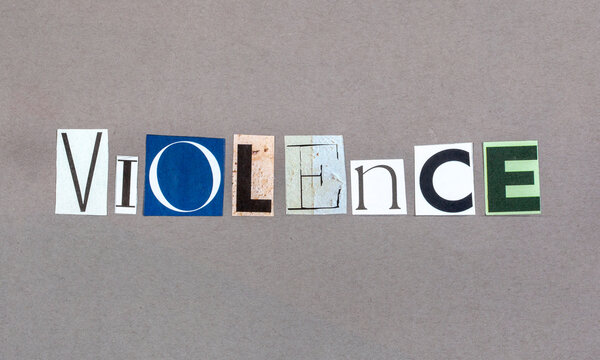 The word Violence in magazine snippets on grey background