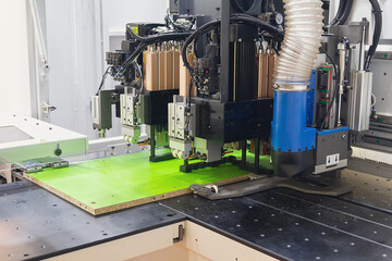 Wood CNC machine at carpentry workshop. Production line of the wooden factory