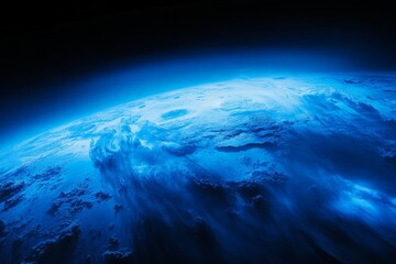 Fototapeta premium A tranquil depiction of a blue planet, surrounded by wispy clouds, floating amidst the vastness of space, creating a serene and peaceful celestial scene.