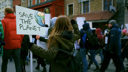 Save planet ecology protest outdoor. Activist person hold anti global warming banner. Eco demonstration placard. No climate change concept. City street picket background. World care rally Earth poster