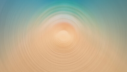 A blurred, circular motion effect image featuring soft tones of blue, green, and beige, resembling a serene abstract scene with a calming gradient.