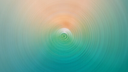 A blurred, circular motion effect image featuring soft tones of blue, green, and beige, resembling a serene abstract scene with a calming gradient.