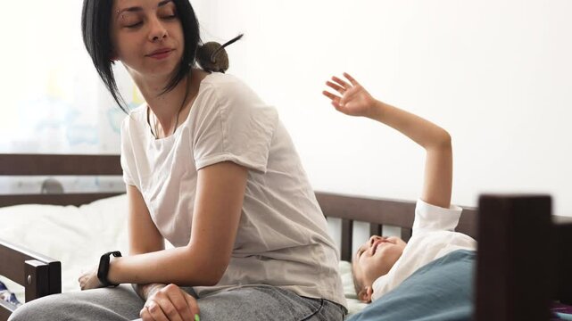 Mother and daughter play with octodon pet. Child plays with squirel degus domestic animal at home.