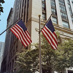 Two American Flags fly in the breeze in front of a building in Lower Manhattan, NYC.