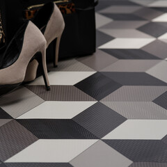 Stylish High Heels on a Geometric Patterned Floor with Fashion Accessories