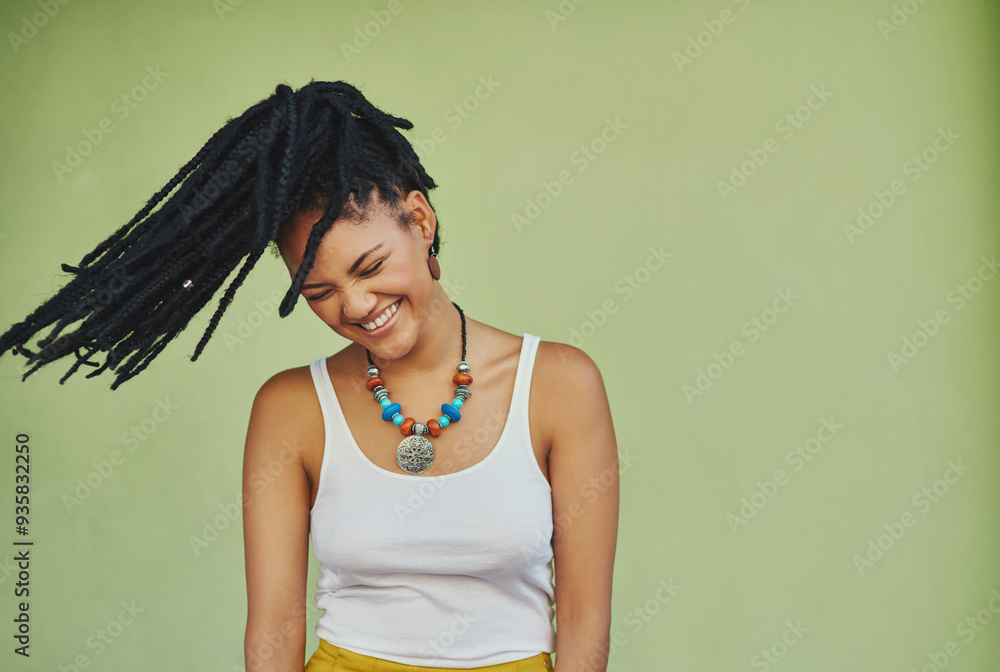 Wall mural Woman, laughing and dreadlocks in studio for fashion, stylish clothes and cool look with confidence. Female person, jewelry and trendy accessory by mockup with hair shake, energy and green background