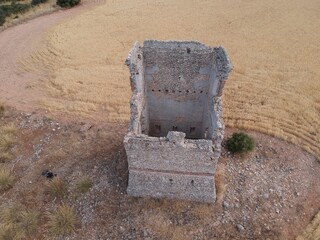 19th-century stone telegraph tower viewed from the air by a drone