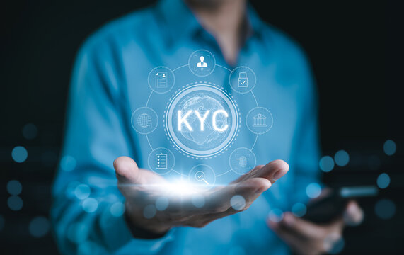 KYC verification concept. Businessman hold glowing digital representation of KYC (Know Your Customer) with compliance and security icons, symbolizing customer identity verification in business. E KYC,