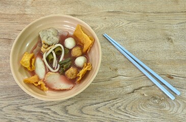 boiled fish and shrimp ball couple dumpling topping pickled cuttlefish in red soybean sauce soup...