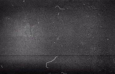 Blank grained film strip texture background with heavy grain, dust and light leak