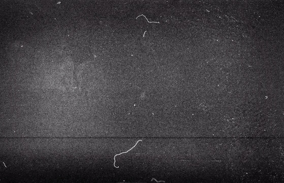 Blank grained film strip texture background with heavy grain, dust and light leak