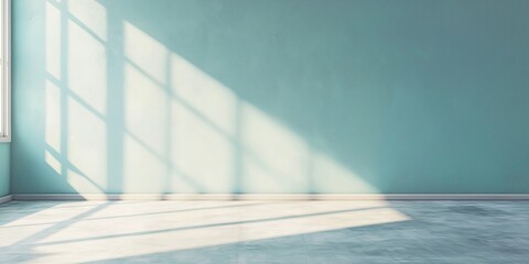 Obraz premium An empty room with tall windows casting sunlight on the floor, highlighting the minimalistic and bright atmosphere of the space.