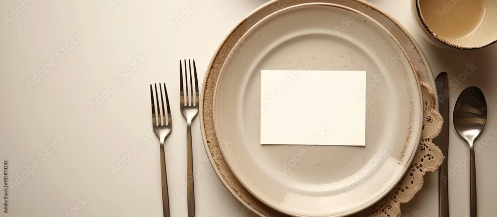 Poster table setting featuring a blank card on a light background. copy space image. place for adding text 