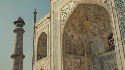 Obraz premium Taj Mahal in India Capture the building's beautiful white marble and intricate inlays. It is a clear example of Mughal architecture.