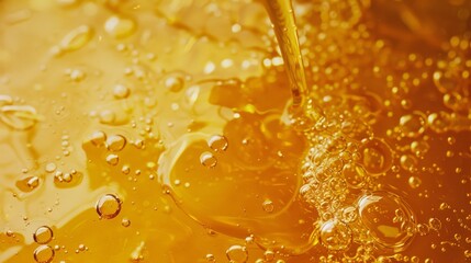 Golden liquid flowing with bubbles rising, reminiscent of honey or syrup, surrounded by a warm, glowing ambiance.