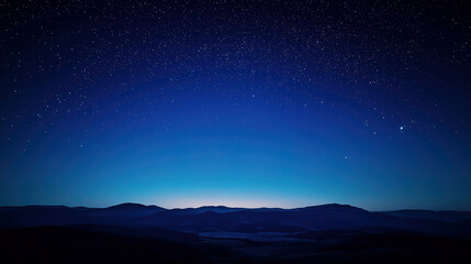 fantastic blue starry sky at night with silhouette of mountains