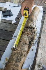Men working in collecting soil for reaserch about water quality