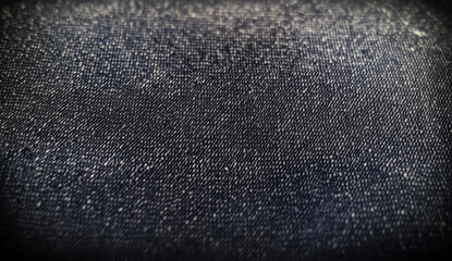 Closeup of denim fabric with visible weave and texture.