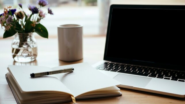Open Notebook, Pen, Laptop, Flowers.