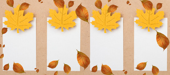 Decorative autumn leaf and blank paper card for text message on a brown background.